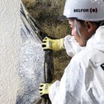 BELFOR Asia employee taking off soot removal film 1920x1080